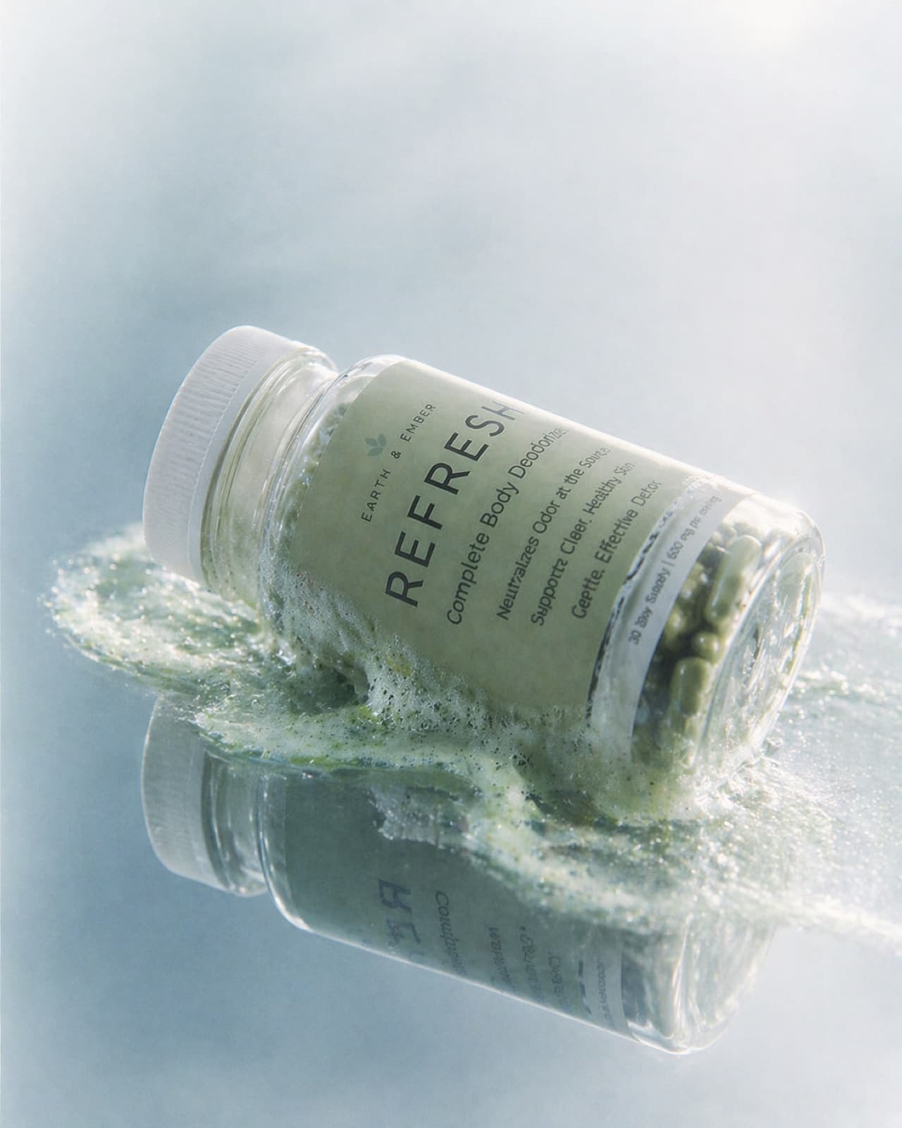 REFRESH bottle beside water as part of a morning routine.